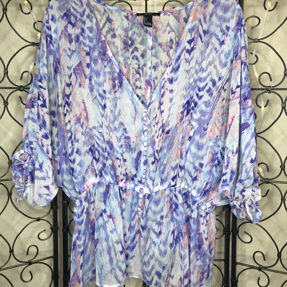 Sheer, colorful blouse with real button detailing